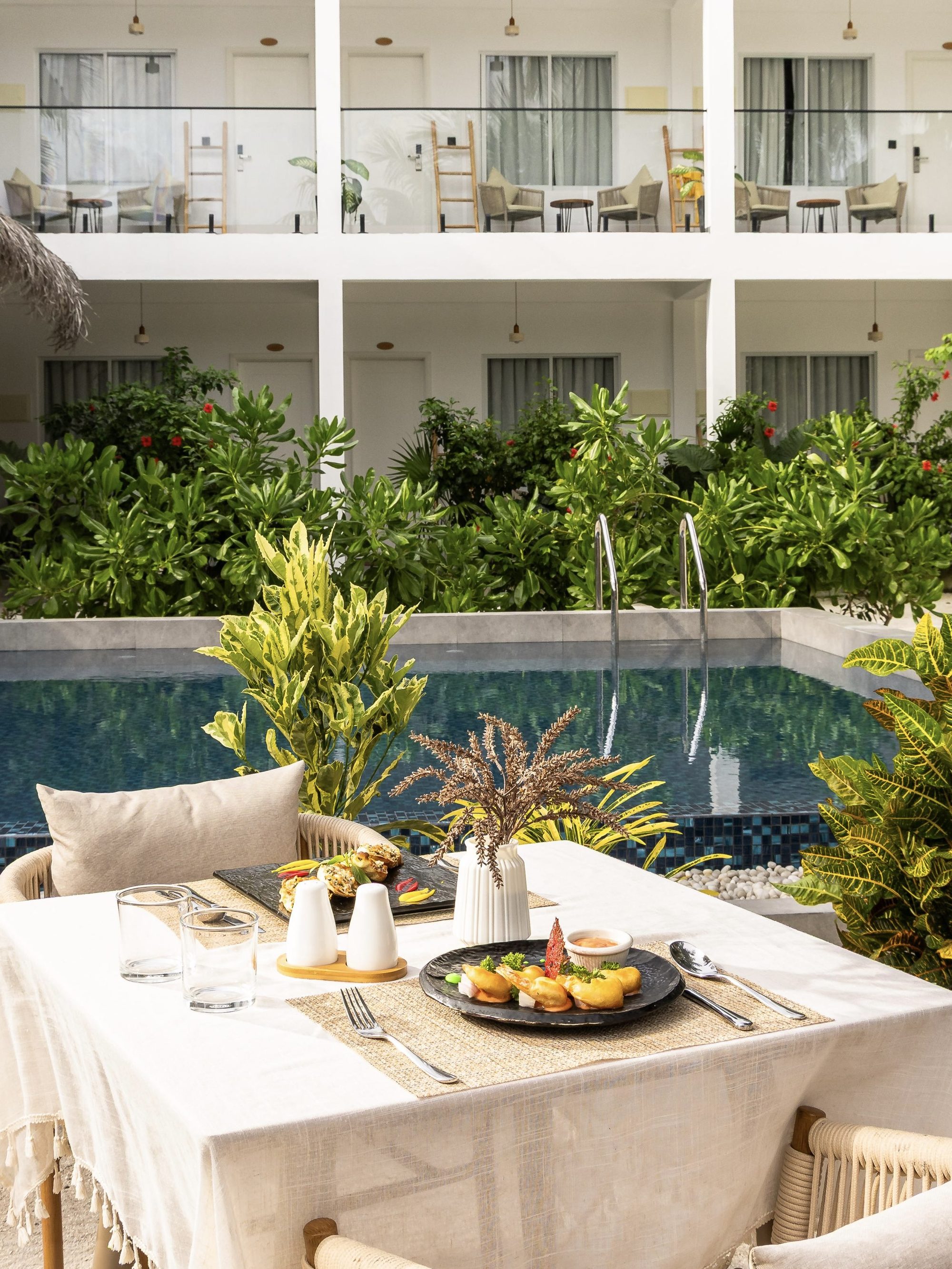 A long table laid beside the pool