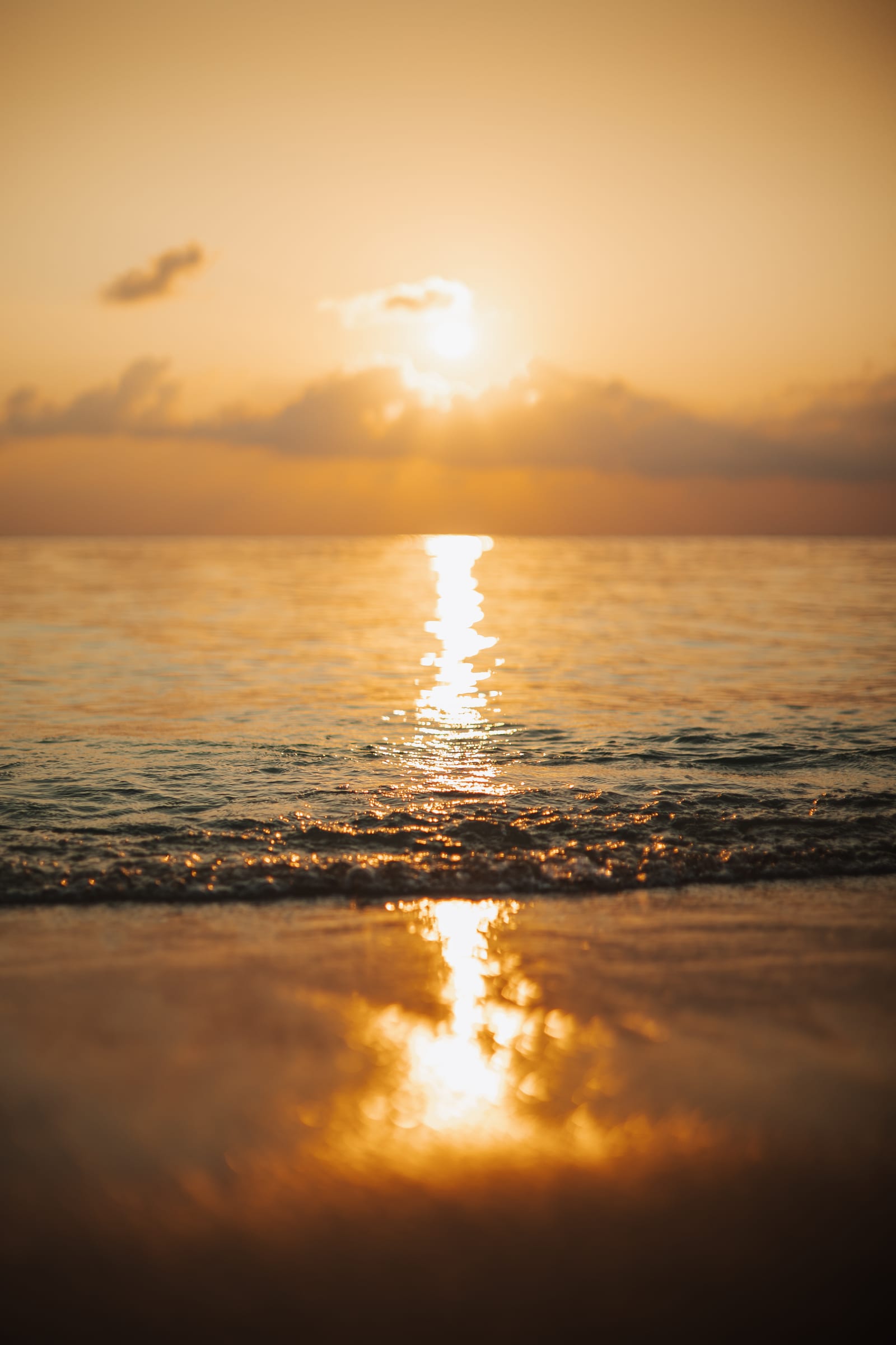 Golden sunset over the calm sea off Thoddoo